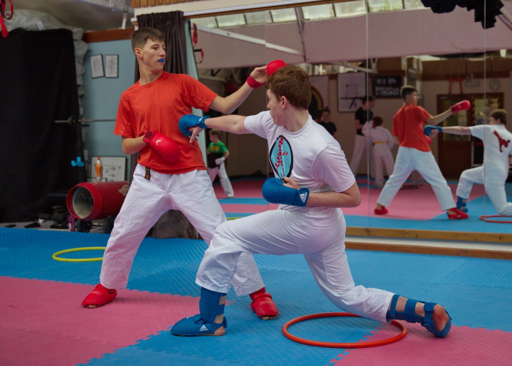 students practicing their kumite techniques