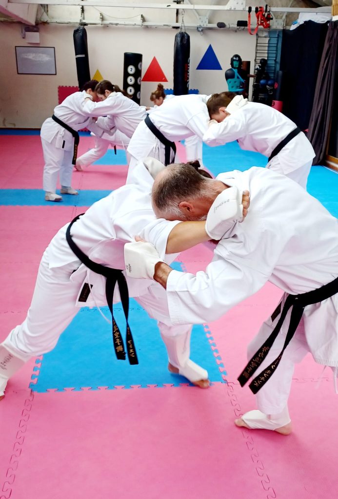 karate students grappling