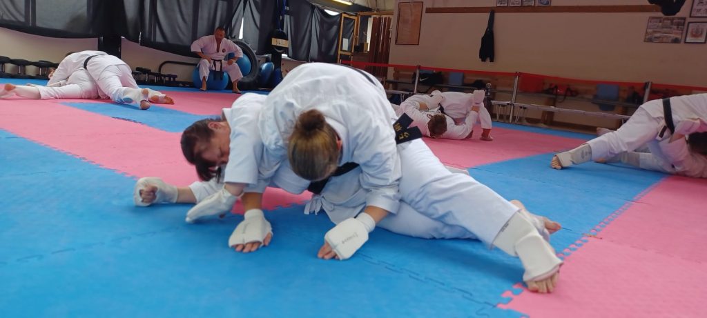 karate students grappling