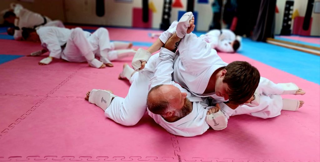 karate students grappling